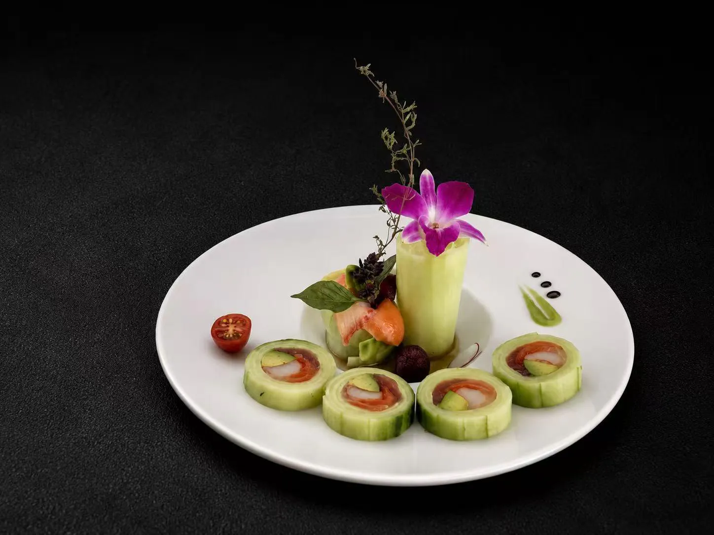 Cucumber-wrapped sushi rolls with sashimi, garnished with orchid at Wasu Sushi Ramen, a Sushi restaurant in Bedminster